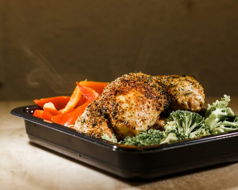 Seasoned roast chicken with peppers and broccoli