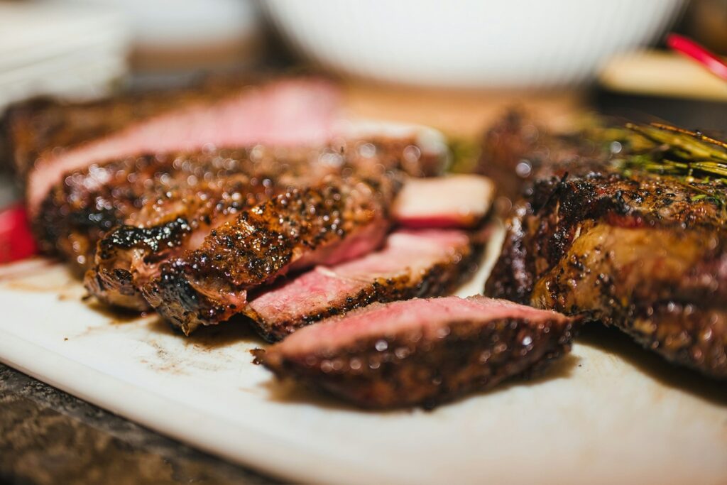 Sliced grilled steak on a board