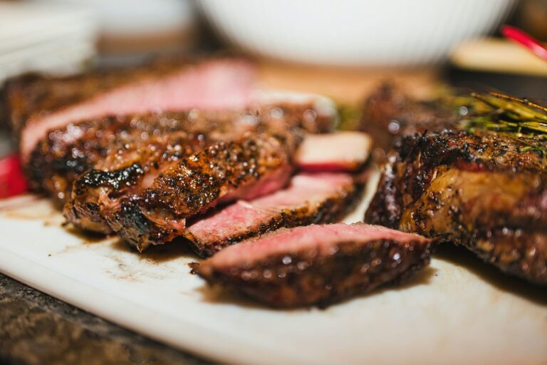 Sliced grilled steak on a board