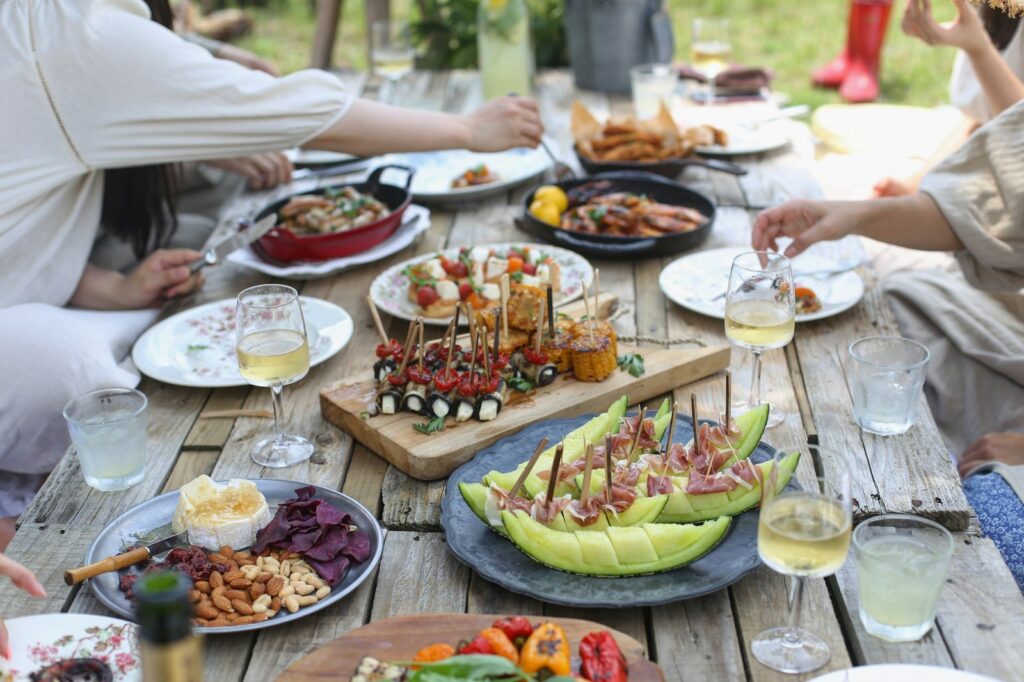 Friends sharing dinner at an outdoor table